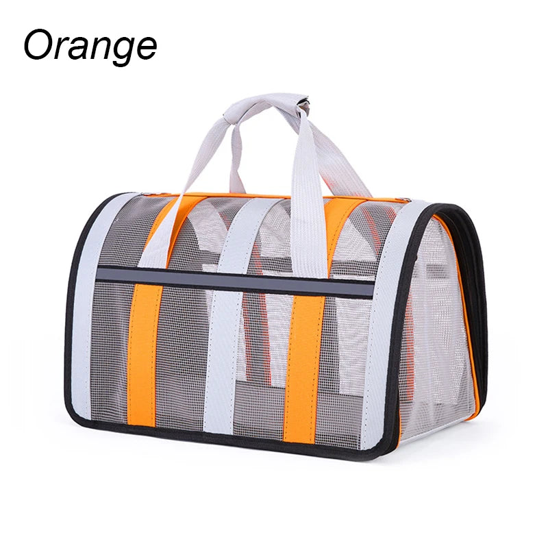 Orange pet carrier with mesh sides on a white background