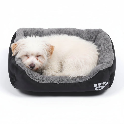 Pet bed with gray interior and black exterior on a white background