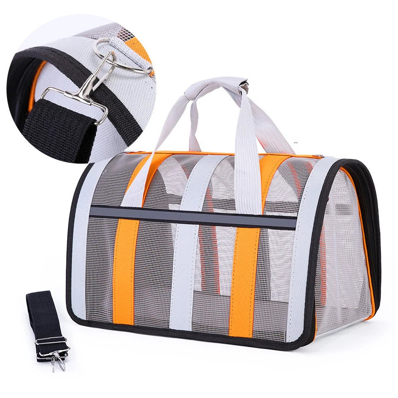 Pet carrier with mesh sides and orange accents on a white background